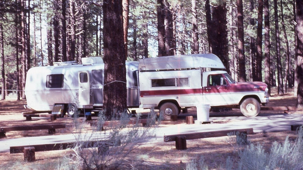 Jasen’s sons beside the family truck during its restoration